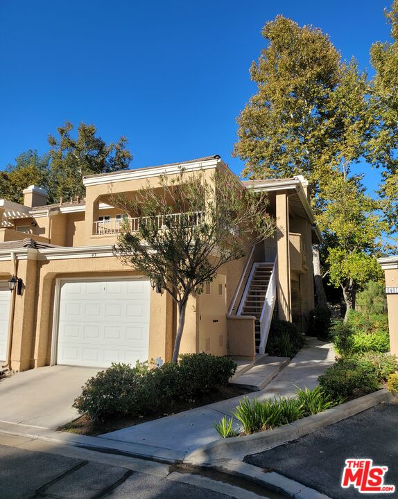 24013 Arroyo Park Dr 43 Santa Clarita, California Your search is over! Enjoy privacy and beautiful park views from this stylish and exclusive upper corner unit in the best part of Valencia's desirable gated Arroyo West Community.This top-floor end-unit condo is beautifully decorated and offers an open floor plan that is light and airy with many windows! The kitchen is open and bright featuring a breakfast bar and a bay window with great views of trees and Summit Park. The Living area features a vaulted ceiling, fireplace, and plantation shutters. Featured in the master bedroom are a dual-sink vanity area and lots of closet space. All rooms have new ceiling fans. The second bedroom features a private balcony and direct access to the second bathroom. The large laundry room has enough space for extra storage. Enjoy the beautiful grounds and community pool/spa that Arroyo West has to offer! This home offers easy access to Summit Park, walking trails, the Paseos, Granary Square, and is close to the Westfield Valencia mall, restaurants, grocery shopping, and freeway access.