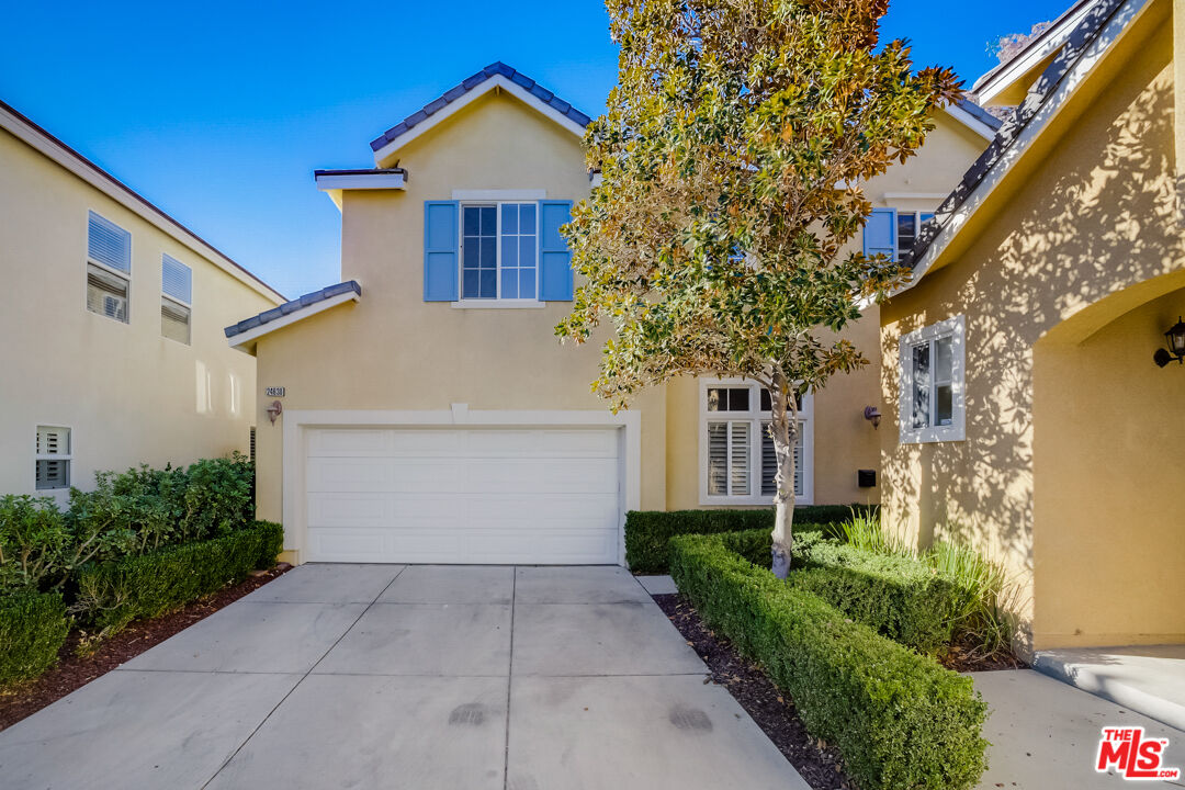 24630 Montevista Cir Santa Clarita, California This Valencia two-story home offers granite countertops, and a two-car garage.