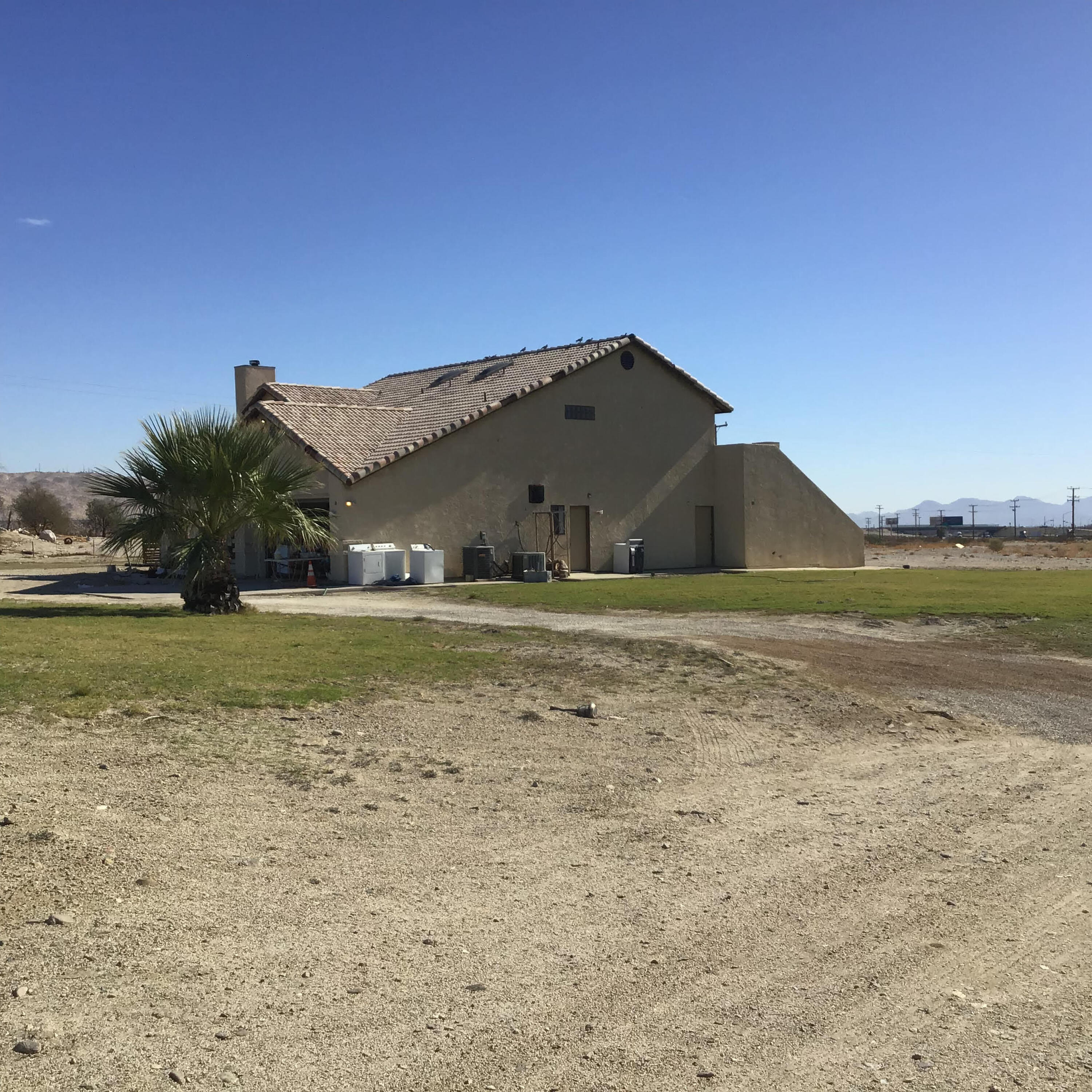 INVESTOR OPPORTUNITY! Large 4 bedroom 2 bath 2 story fixer with mountain views has endless potential. This home has tile flooring through out and carpet in hallways stairs and bedrooms, fireplace, spacious den/office area, double car garage, large patio space, RV parking and over 7.8 acres of land for investors to expand their your Cannabis Business in Desert Hot Springs The city of Desert Hot Springs is Pro-Development and Pro-Cannabis. This location is perfect with 10 freeway  frontage. Seller will consider holding a note for 2-5 years with $500K down and a reasonable interest rate. Minutes to Palm Springs for dining and shopping, Casino Morongo and Cabazon Outlets. Needs TLC!