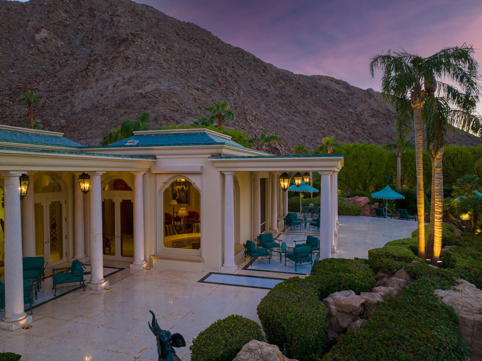 This extraordinary estate home exudes unyielded craftsmanship in its architectural design, construction elements and interior decor. The two-story residence was built by Gerry Langlois Construction under the watchful eyes of Beverly Hills architect, Bob Ray Offenhauser and decorator, John Cottrell. Its warm welcome greets you and your guests by echoing the epitome of desert living and entertainment. Located within the prestigious city of Indian Wells, California, this creatively positioned home sits along the gold coast of The Vintage Club offering commanding views of the 17th Hole of the Mountain Course boasting lush fairways, meandering lakes with waterfalls and the valley's surrounding mountain ranges. Through years of purchasing furnishings abroad, each room is a study of resplendent taste. An entertainer's paradise, the splendid columned patio areas can accommodate nearly a hundred guests for dining amid unparalleled views. The surrounding landscape is kept at perfection and the lagoon-style swimming pool with rock-cropped waterfall is set away from the main residence offering privacy and a personal sense of swimming in a crystal-clear lake. Consider the obtainable experiences of this unique residence and embrace the ultimate lifestyle of excellence.