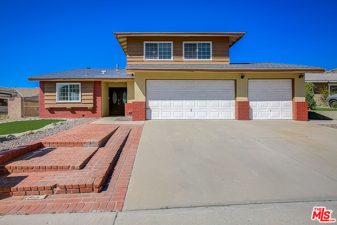 6697 Charing ST Simi Valley, California This Simi Valley two-story home offers a patio, and a three-car garage.