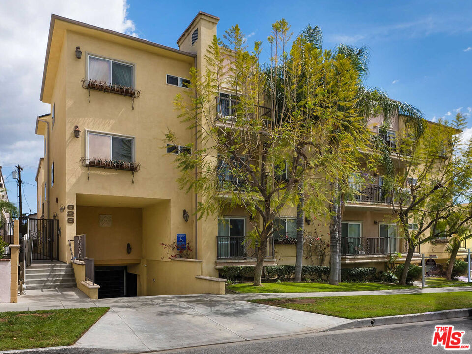 626 E Orange Grove AVE 205 Burbank, California Perched in the prestigious Burbank hills above Glenoaks, just a short jaunt to the heart of downtown Burbank for dinner and a movie, this 2005 built corner-unit luxury condo has it all! A brand new kitchen remodel boasts Quartz Counters, custom gray lacquer cabinets and new stainless appliances that have never been used! This renovated unit has high ceilings, recessed lighting, crown molding, fresh paint and a private outdoor balcony space with views of Griffith Park, the Hollywood Hills and the majestic Wisdom Tree! The primary bedroom suite has a large walk-in closet with serene paint tones, and a sumptuous Master Bath, just remodeled with custom tile and Quartz counters, dual sinks and touch illuminated lighting. A secondary bedroom is also en-suite and generously sized. Double-paned windows, central air, private in-unit laundry and a powder room off the living space are just a few of the conveniences making this condo feel like a home. The beautifully landscaped grounds feature tranquil fountains, exotic palm trees and greenery blossoming amidst an open center courtyard. Other amenities include two underground secured garage parking spots, storage, an elevator and wheelchair lift and a shared rooftop deck/lounge with BBQ area and Mountain views to entertain guests and enjoy evening sunsets. Amazing schools and Burbank services, low HOA's, studio close with countless restaurants and shopping close bythis highly desirable property leaves absolutely nothing to be desired!