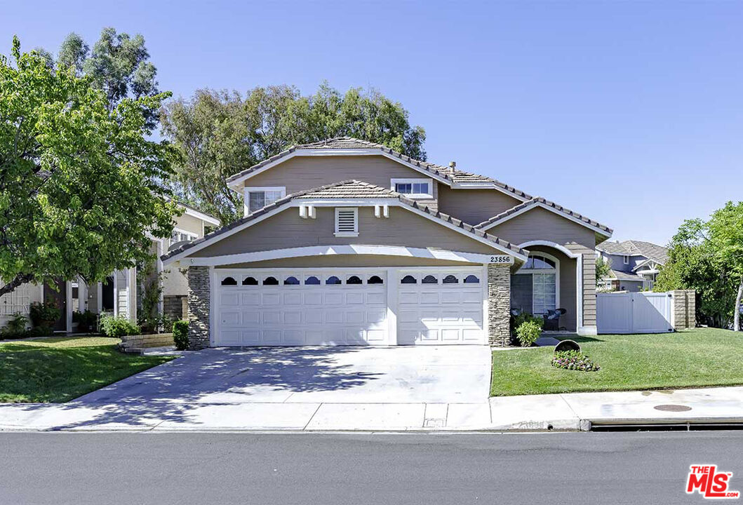 23856 Chadsford DR Valencia, California RARE LARGE CORNER LOT WITH GATED RV PARKING! Welcome to this charming home located in the desirable Northbridge community of Valencia. The house is on the corner of a cul-de-sac with a large backyard and only 1 neighbor to the right. The first level holds a living room, family room, dining and breakfast area, 4th bedroom that is perfect for an office or playroom, laundry room, and direct access to a three-car garage. In the garage, previous owners made a perfect space that is good for office or multi-purpose use. Remaining 3 bedrooms are upstairs, including spacious primary bedroom with a large en-suite bathroom and walk-in closet. This home has high ceilings and big picture windows, allowing plenty of natural light throughout the day. The water heater is new, less than a year old, and a soft water line is installed. The garage includes a 220v electric car charger and Tesla supercharging station is also located less than a quarter-mile from home. Walking and short drive distance to award-winning school district and conveniently located with easy access to freeway, shops, and restaurants. The community boasts immaculate grounds maintained by HOA and includes access to 3 community swimming pools, paseos and walking trails, tennis court, basketball court, playground, clubhouse, and a beautiful park with a picnic and BBQ area. No Mello Roos and low HOA!