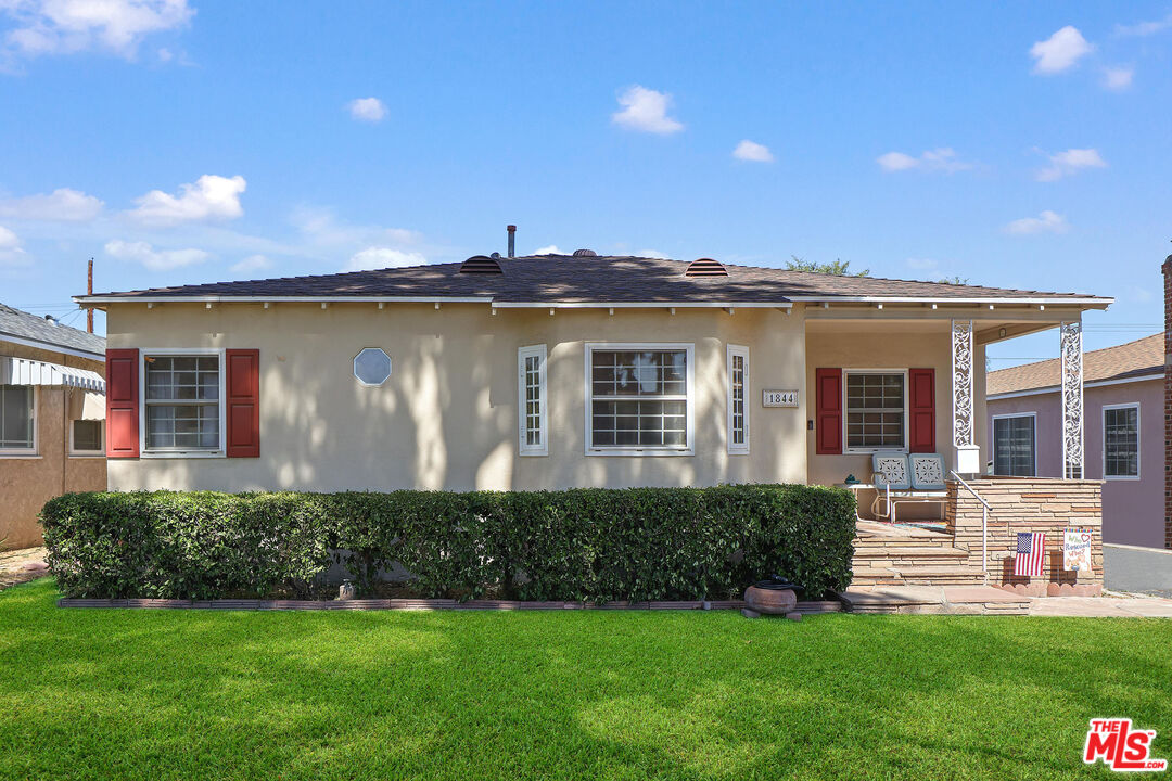1844 N Pass AVE Burbank, California Charming 3+1.5 home located on a tree-lined street in the heart of Burbank! A quaint covered front porch greets you as you arrive. Enter to find rich hardwood flooring throughout. The living room is open to the dining room with built-ins and large windows allowing natural light to beam through. The eat-in kitchen has granite counters along with plenty of cabinet and prep space. Off the kitchen is the family room with fireplace, vaulted ceilings, built-ins and double doors that lead you out to the back. All three bedrooms are generously sized and the full bath has a vanity with storage and tub/shower combo. The backyard has a patio and large grassy area. There is also a detached 2-car garage with a workshop in the back. Situated in the award-winning Burbank School District, moments to studios, freeways and shopping, welcome!