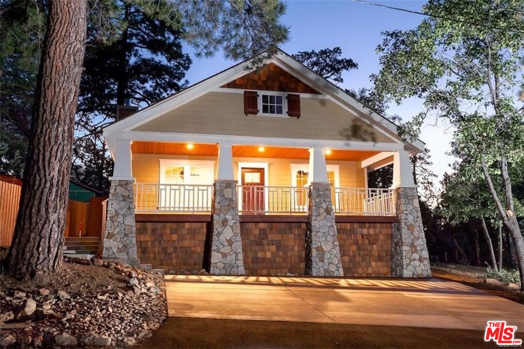Luxury California Craftsman built in 2018, with 3 bedroom + 2 bath steps away from the National Forest. This custom architectural home features vaulted ceilings, has a gourmet kitchen with stainless steel appliances + granite counters, and a classic oversize Craftsman front porch perfect for lounging and get togethers. Large open concept great room with wood burning stove and recessed lighting. High-end rustic laminate flooring throughout. Master bedroom features a large walk-in closet, an en suite bathroom w/ duel vanities and opulent walk-in shower. Sliding glass door leads to a wooden deck in the backyard perfect for a jacuzzi or bbq. Large laundry room with washer/dryer, ample counter space, and storage cabinets. Smart features include Nest thermostat, programmable door lock, automatic floodlights,  cameras throughout the exterior and security system. Massive newly built driveway that can accommodate a large RV, boat, or 4-5 cars. Large storage room under the house and attic space with window. 5,000 square foot lot next is also available for sale.