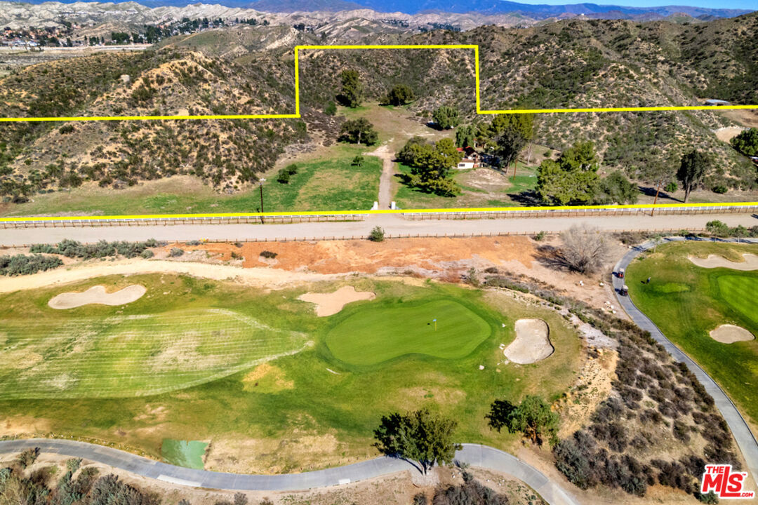 Here is your chance to own over 12 acres of private & peaceful land in the prestigious Sand Canyon area of Canyon Country.  Tucked back and secluded from the main thoroughfare of Sand Canyon Road, "Oak Springs Ranch" is surrounded by trees and hills and nestled in its own beautiful valley adjacent to the Sand Canyon Country Club and Golf Course.  There is approximately a 1,300 ft frontage with views of the Golf Course, Club House and mountains.   Enjoy gorgeous sunsets and the blue open sky!  Large usable area along the mountain side offers the opportunity to build your dream home with plenty of space for horses.  You can renovate the current home & pool and/or develop the property further.  This wonderful property offers the opportunity to be an unprecedented site for ranch living and offers the potential for significant upside value in a desirable and developing location.  Nearby is the proposed Mancara development.  Sand Canyon offers a true escape from the city, yet is just a short commute to the LA area.