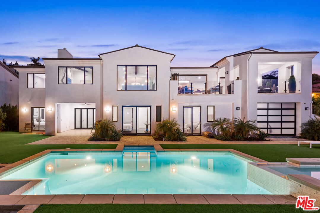 29858 Knoll View Dr Rancho Palos Verdes, California Stunning newer construction contemporary view home in the coveted Miraleste Hills of Rancho Palos Verdes. Newly constructed in 2018, with basement, additional guestroom and pool construction completed in 2022. Just under 6000sqft with 5 bedrooms, 5 bathrooms, with a game room, several indoor and outdoor entertaining spaces, a flex room and views of snowcapped mountains, Downtown LA, Long Beach, to the port and the ocean. Privacy prevails with the entrance set back from the street. Enter on the main living level, with two living rooms, open kitchen with stainless steel Thermador appliances, glass enclosed wine rack, and a large balcony overlooking the pool and views. Also on the main level is the primary suite, oversized walk-in closet, an additional salon prep room, powder room, as well as access to the 3-car garage. The lower level is home to 4 additional bedrooms, den, game room, large flex room (currently a gym), and access to the beautiful backyard with pool, spa, fire pit and easy maintenance turf yard. Don't forget about the evening sunsets and sparkling lights from this beauty. Life is to be enjoyed and this is the place to do it.