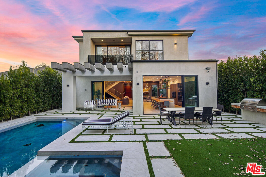 Stunning 2019 new construction in the heart of Valley Village/Studio City. The massive walnut front door of this modern masterpiece welcomes you to the perfect blend of indoor/outdoor flow and open space design. A perfect balance of modern yet cozy professionally designed for Feng Shui in every room with unique high ceilings throughout the entire home. Gourmet kitchen with top of the line Miele appliances and spacious large island with custom cabinetry throughout. The kitchen presents professional grade refrigerator that possess new technology capabilities of self closing and opening doors as well as touch screens. Fully equipped smart home that controls music, lights, spa lights, air condition, security cameras, and security system. High end Aquabrass plumbing fixtures as well as solid walnut doors throughout the house. The glass stair case is upgraded with a self watering planter underneath and massive interior windows for endless natural lighting. The luxurious Italian tiles in the living room and kitchen flow smoothly through into the outside as well via the custom sliding doors opening up the home entirely, becoming one with the private backyard. Where you will discover a beautiful sheltered sitting area, outdoor kitchen, upgraded with high-quality artificial grass yard along with a luxurious pool and spa with fountain features. Once you retreat upstairs, you will discover vaulted ceilings, custom bathrooms and high-end, touch activated washer and dryer. Turning into the master suite, you are invited once again with open space and a perfect harmony of bedroom bathroom inclusive of a premium soaking tub with a view and a massive couples steam shower and two upstairs balconies. Home is upgraded with a water softener to filter out hard metals in water to nourish skin and hair. Two-car garage. Security gate and and side gate as well as artificial grass upgrade in the front yard as well for better use of the outdoor patio and space. Close proximity to restaurants and shops on Tujunga Blvd and a walk to the local farmers market in the hip area for creators of Studio City. Only a ten minute drive to Hollywood and 20 minutes to Beverly Hills!