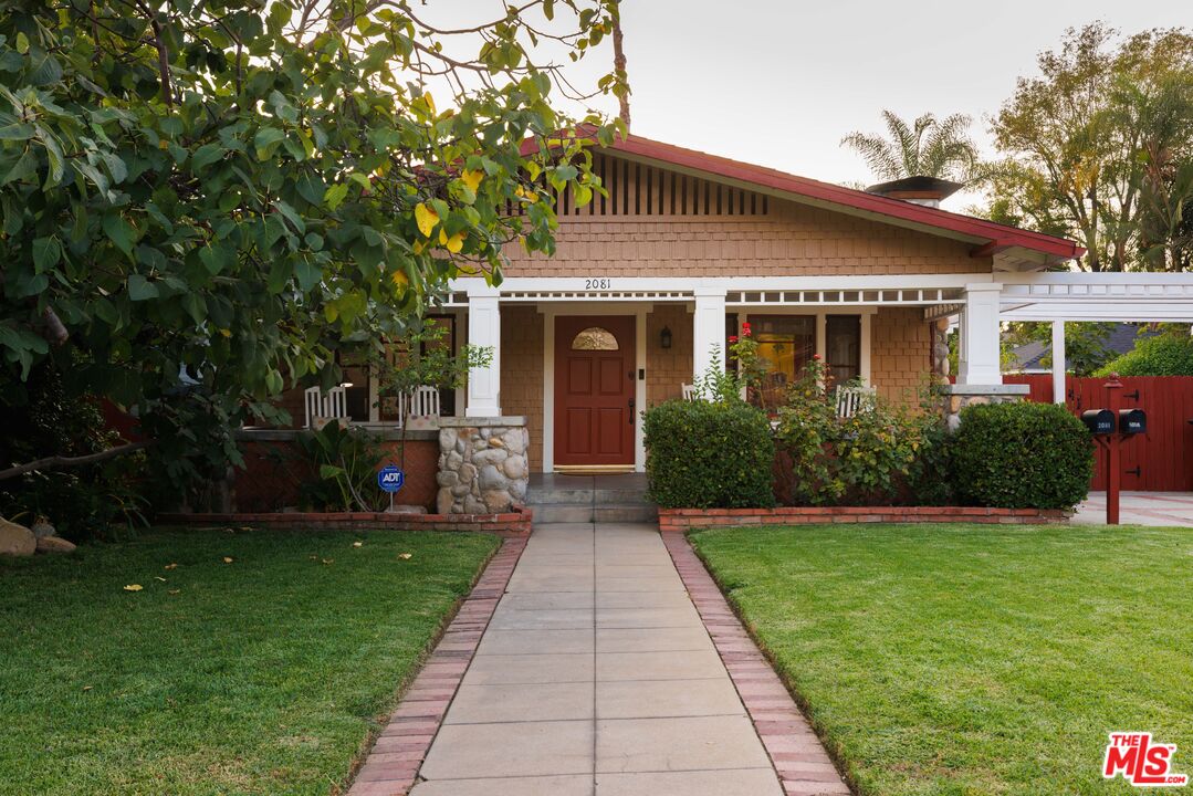 This 1917 Craftsman bungalow is situated on a friendly block in central Altadena, boasting views of the San Gabriel mountains and palm trees. Both the main house and the guest cottage have been very profitable vacation rentals (on AirBnB and VRBO,) bringing in six figures in 2021. Continuing to rent one or the otheror bothcould be an excellent opportunity to offset your monthly costs. Classic river rock pillars welcome you onto a peaceful front porch, set back from the large, flat, grassy front yard. The home maintains its original hardwood floors and river rock fireplace, while the floor plan has been opened up for a brighter and more contemporary feel. In addition to the main home's three bedrooms, the spacious den offers extra space to relax and the California basement gives you extra storage. The main home's deck looks out over the generously sized pool and spa, and across the way is an adorable and independent guest house. The guest house features two entrances, offering privacy for you and your guests, and direct access to the pool.  2081 Lewis Ave is conveniently located and nearby neighborhood favorites like Cafe de Leche, Side Pie, The Rancho, Amara Kitchen, Seed Bakery, Roma Market, and a wide variety of hiking trails to the north and shopping and dining options to the south.