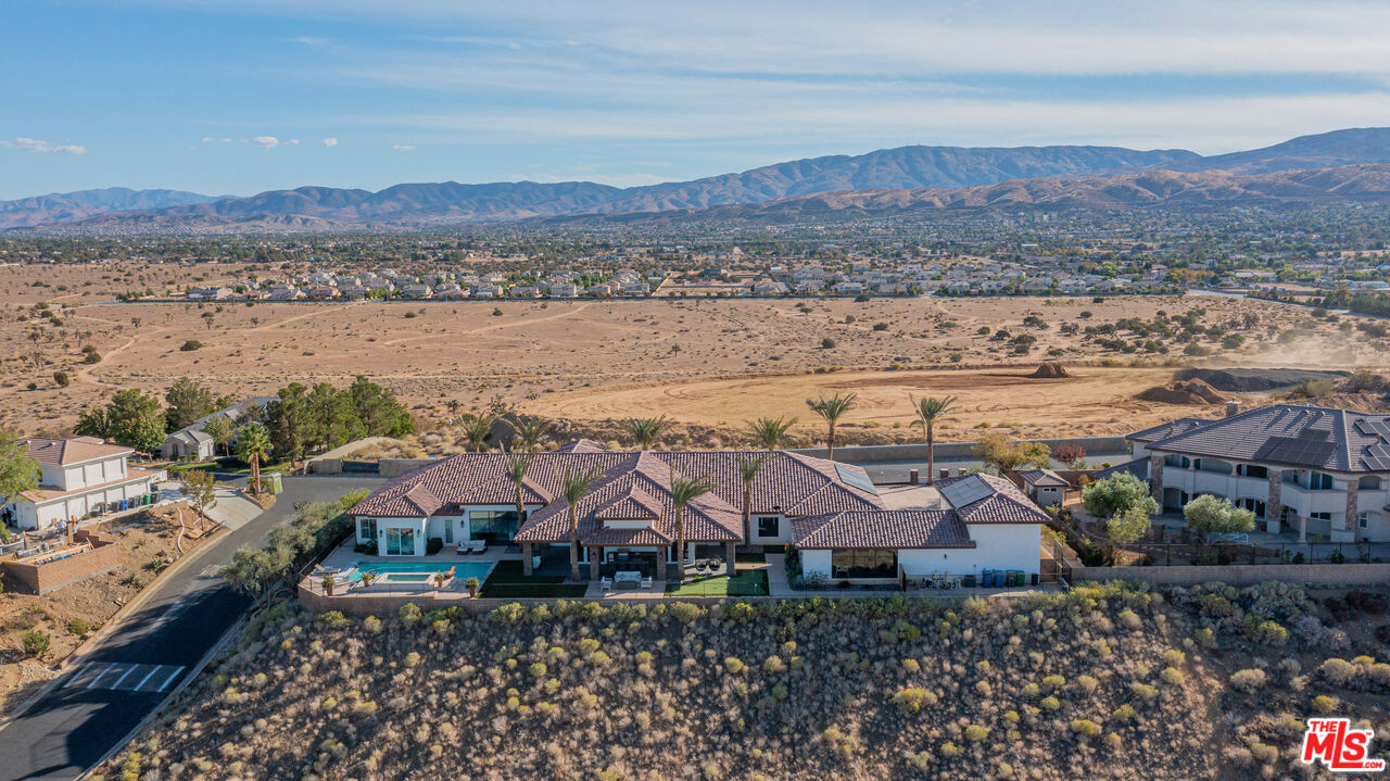 Perched above all other homes in the most prestigious gated community of Los Hermanos.ULTIMATE PRIVACY AND SECURITY! Built In 2019, This Property Offers A Near 7,000 Sq Ft Single Story Main House, And Additional Near 900 Sq Ft Casita, 10ft to 18ft ceilings With Custom Beams And Stone Accent Walls Throughout. Luxurious his and hers Master Closets w/ Built-Ins, Master Bathroom Includes His & Hers Showers With Steam Room. Surround Sound, Upgraded Flooring, Baseboards, Crown Molding, Wainscoting Throughout! The Stunning Chef's Kitchen Boasts Custom Cabinetry, A 6 Burner Stove w/ A Pot Filler, Custom Sub-Zero Wine Fridge, Custom Counters with Extra Large Center Island, And A Large Walk-In Pantry. Theater Room That Offers A MASSIVE Projector Screen, Theater Grade Surround Sound System, Large Game Room, 4 Bedrooms PLUS An Office That Can Easily Be Used As A 5th Bedroom. All Bedrooms Have Their Own Full Bathroom And Walk-In Closets. Panoramic Sliding Doors Provides The Perfect Indoor/ Outdoor Living! Entertain Friends & Family While Creating Lasting Memories In Your Resort-Style Backyard That Offers A Pool, Large Spa, Fire-pit, Built-In BBQ, An Outdoor Bathroom, All with breathtaking 250 degree views with unmatched privacy! Oversized 5 Car Garage, With Detached RV Garage. All Concrete is Custom Colored & Stamped. Plus Paid Solar! The Los Hermanos Community Offers Tennis Courts, Basketball Courts, Security, And A Playground. This Luxurious Custom-Built Oasis Estate Is Truly One Of The City's Best Kept Secrets! NO MELLO-ROOS.
