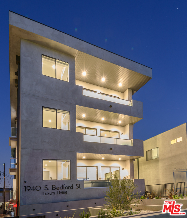 1940 S Bedford ST Los Angeles, California Located in Beverlywood is a stunning ultra-modern multiunit! This meticulously maintained building comes with 3 identical 4 beds, 4.5 bath units. Each unit is 3,300 SqFt. Inside each unit (directly accessible via elevator) has minimalistic designer finishes, sleek lines, custom closets, hardwood flooring, and more! Each kitchen includes top-of-the-line appliances (Wolf and Miele), quartz countertops, and plenty of counter space perfect for an amateur chef. The living areas boast built-in shelving, tons of natural light, an intercom system, and surround sound. Each unit has its own built-in washer and dryer. This entire building comes equipped with video surveillance to ensure security for tenants, controlled access, plenty of storage space, and 3 parking spots per unit. The rooftop features a jaw-dropping unobstructed 360-degree view of Los Angeles. All units are ready to rent with a projected income of about $33,000/month. Don't miss out on this great investment opportunity!