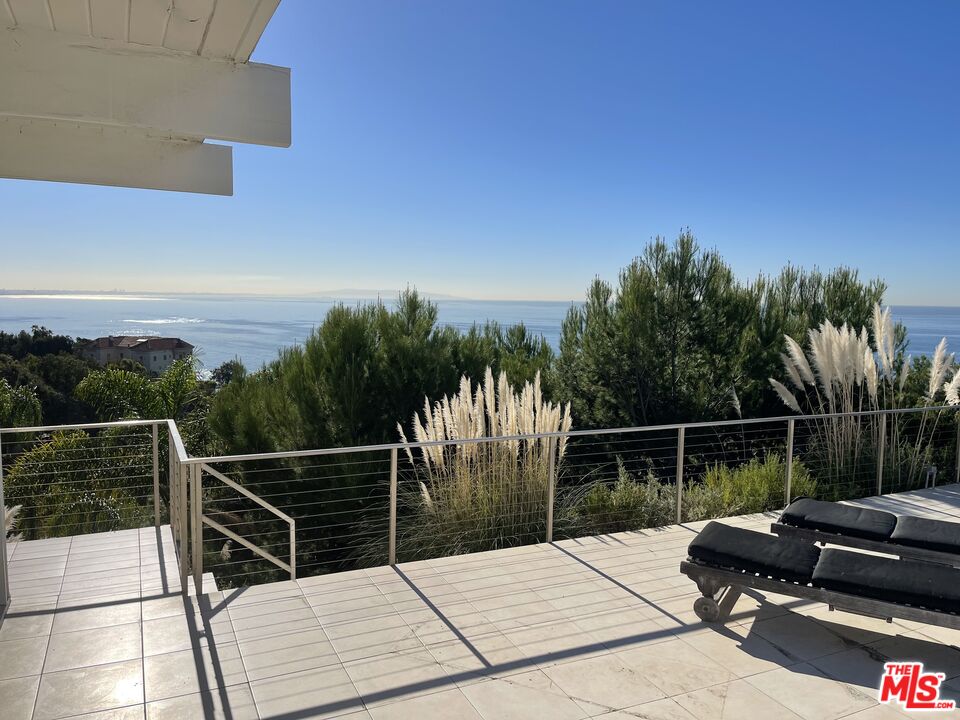 Views you will never get tired of! This mid-century jewel is sitting on a beautiful promontory, at the cusp of Malibu and Pacific Palisades, and boasts amazing unobstructed views of the Pacific. Sold with permitted plans by famous European architect prior to remodelling, this is the perfect opportunity for Buyer to put the finishing touches to their dream above the waves and choose own colours. Current floor plan has 3 Bedrooms, 3 Bathrooms plus a pool bathroom and an open living area. Just sit by the pool or inside, with vast walls of glass, reminiscent of architects like Elwood and Neutra, and watch the coastline, sail boats during the day and the Queens Necklace sparkle at night, all the way to the San Pedro Peninsula and Catalina island. Perfect for parties and events, or just lock the door and enjoy tranquility. With this post and beam gem you can have it all! Private, at the end of a Cul-de-Sac, rare over 17,000 square feet, lot.