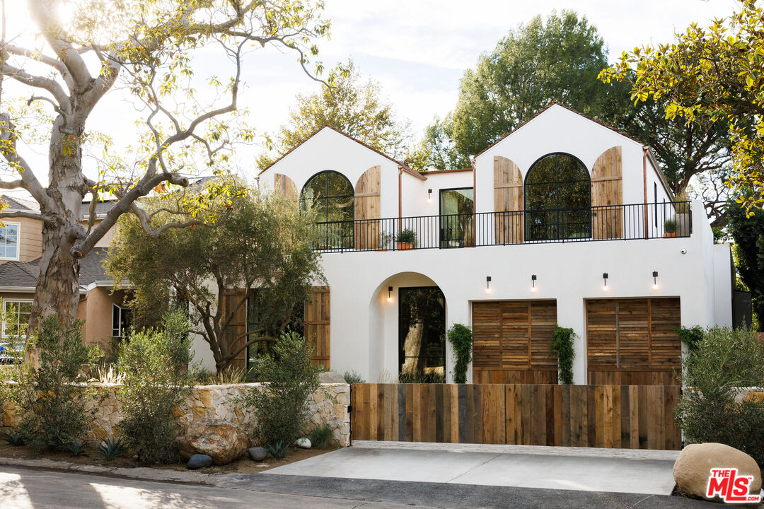 4137 Mary Ellen Ave Studio City, California Located on a quiet tree lined street within Longridge Estates sits this new construction masterpiece. The grounds have been artfully curated with a detached full-service guest house. The orientation of shapes and texture has been executed with brilliance. Two A frames sit above large center mass giving way to upper floor deck gardens. The sequential progression of spaces have been mindfully crafted using texture, light and the unexpected. Upon entering the grand center hallway, you are met with sanded limestone, oak encased large beams and Apparatus studio lighting. A large private den/bar area sits tucked in with a private courtyard great for entertaining. Primary living room, dining room and kitchen are flanked by large steel Euroline steel doors systems. A fully-equipped prep kitchen sits proudly behind the main kitchen perfect for large gatherings. A grand center staircase with fluted clay walls, custom brass handrails and overhead lighting lead you to the upper floor landing area with 14-foot steel skylight and garden views. Primary bedroom shows restraint using a barreled clay ceiling, vintage lighting and custom woven linen drapery. Dual closets grounded by white oak cabinetry, custom hardware, vintage makeup mirrors and Sub-Zero refrigeration. The primary bathroom is curated with Calcutta Marble, massive shower stall with steel door leading you to an outdoor garden bathtub, Samuel Heath water fixtures and lighting from Allied Maker. The private and stunning rear yard boasts a full-service guest house, large black bottom pool, infrared sauna, fire pit sitting area and ample space to both entertain and relax. Rob Diaz, Mark Alexander and Anastasia Ratia spared no expense or detail in creating this timeless jewel.