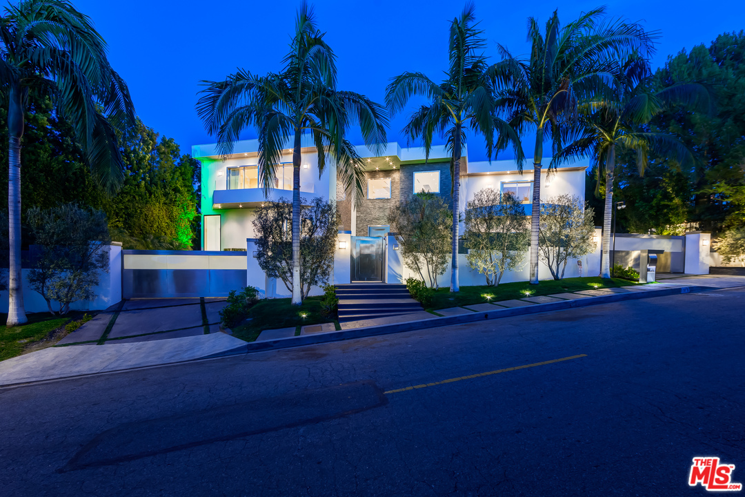 1518 Bel Air RD Los Angeles, California Glamorous contemporary living in prime Bel Air. A true timeless masterpiece featuring the latest in technology, materials and infused with Old World class and spectacular magic. Completely remodeled and completed in 2014. A state-of-the-art open floor plan, grand open kitchen/family room and breakfast nook seating for 10. A master wing with extensive private outdoor covered patio, fireplace, infinite his and her master baths and closets designed for today's royalty. This home also features, a vacuum elevator, theater, office, 23' grand foyer ceilings and high ceilings throughout. 3 exquisite staircases, 70' quartz infinity pool spilling into a picture perfect view, remote controlled disappearing walls of glass seamlessly joining the outdoor living rooms and patios with the decadent grand rooms inside. Gated circular motor-court for 10 cars with oversized 3-car garage. Extremely private with endless and breathtaking mountaintop views.