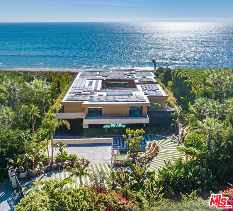 Modern Zen Malibu compound featuring a spacious living space boasting a magnificent 95' tiled infinity pool with panoramic, unobstructed views of the Pacific. Built-in 2022 by MKH Developments and set behind a gated drive for ultimate privacy. This eclectic masterpiece was influenced by ancient civilizations which ultimately created a sanctuary that lives up to its name, The Kaizen Home, which is the Japanese word for the pursuit of perfection. Every single aspect of this home, from the architecture and interior design to the landscape and water features was meticulously planned to incorporate Feng Shui. The entire home was constructed from concrete utilizing floor-to-ceiling frameless glass from Germany and the exterior is layered in travertine, composite wood, and carved stone to create a one-of-a-kind home that was built to last. Custom designed details throughout the home include hand-carved stone and wood walls throughout, 2,000 gallon aquarium, backlit Onyx , live walls and a Dolby Atmos home theater. This home offers 6 BD, each with their own private outdoor terrace as well as 2 spacious 4 car garages with electric car charging and ample parking for guests. Set in Malibu, just across the PCH from County Line Beach and minutes from Trancas Canyon and Zuma Beach.