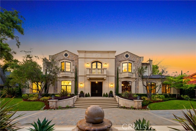 Newly built by Mur-Sol Construction, this Robert Tong-designed Arcadia estate exemplifies the highest standard of luxury living. Set on a gated, private circular driveway, surrounded by meticulous landscaping, it has a magnificent entryway with double doors that lead to a soaring domed foyer with a splendid chandelier. A sweeping dual staircase with ornate wrought-iron railings, gleaming white slab marble with contrasting accents, and beautiful millwork welcome you to the stunning interior. Pass through the graceful archways that connect your formal gathering areas, from the fireplace-warmed living room to the dining room that sits under elegant tray ceilings. Multiple windows usher in abundant radiant sun that casts a rich glow on the gorgeous hardwood floors. Intricately detailed French doors, coffered ceilings, custom built-in shelving, and handsome dark wood paneling lend an old-world feel to the home office. An open-plan family area has refreshing views of the shimmering pool through expansive arrays of glass that seamlessly blend indoor/outdoor living. Shake up craft cocktails at the wet bar, or grab your favorite selection from the wine cabinet. An adjacent dining area is ideal for enjoying more casual fare. Expertly crafted for the avid cook, the all-white kitchen is sure to impress. The countertops are marble, there's ample seating at the oversized island, and you'll have a Wolf multi-burner range with double ovens. Among the many other specialized spaces in this incredible residence are a private screening room with a bar and a versatile bonus room suitable for a gym or recreation den. Your primary bedroom is an opulent retreat, featuring a sunlit seating area with a two-sided fireplace and a must-see wardrobe room. Pamper yourself in the ensuite complete with dual vanities, a generously sized frameless-glass rainfall shower, and a soothing, free-standing soaking tub. You'll also have a private sauna. The extended tiled patio offers nearly endless entertaining options surrounding a refreshing pool with a swim-up bar for thirsty guests, a waterfall feature, and a translucent spa. There's a built-in kitchen with a beverage fridge for weekend cookouts and a fire pit to chase away the chill. A very long list of the benefits you'll enjoy with this impeccable abode includes a private tennis court. Its optimal location gives you easy access to shopping, dining, the Los Angeles Arboretum and Botanic Garden, downtown Arcadia.