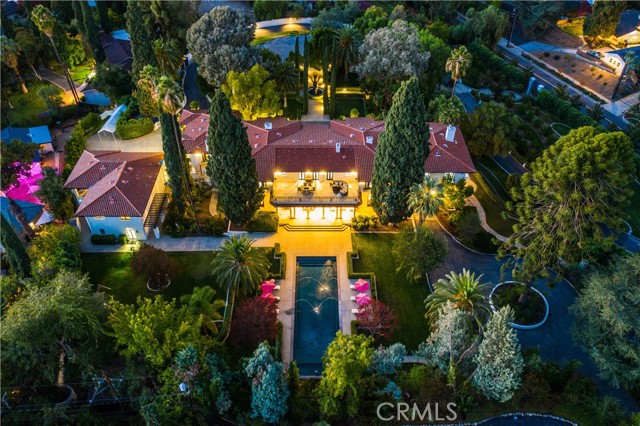 Experience the pinnacle of luxury living and Old World panache in this completely private, sprawling estate located in one of Redlands  most picturesque regions. Step inside the main house to find a myriad of mostly imported, upmarket features including tray and coffered ceilings, handcrafted woodwork, arched entryways, imported chandeliers, 6 hand carved wood fireplaces, and decadent Calacatta marble flooring. The entertainer s kitchen is built for celebrating and features imported lapis blue granite countertops, custom Mexican tile, Gaggenau Sub-Zero & refrigeration, and elite French-made La Cornue range. With endless relaxation areas, including expansive family room, living room, subterranean media room, patios, and loggias, you ll have plenty of space to entertain guests, enjoy evening refreshments, or simply unplug. Unwind in the 5-star resort inspired primary suite with living room, soaking tub, dual walk-in shower, dressing room, and balcony overlooking the 3.64-acre property. An attached 3bd/1ba maid s quarters is ideal for live-in help, while a 3bd/1ba ADU with a Kitchen& gym, sits atop the garage, offers the perfect home for guests. Step outside to the manicured grounds with main and guesthouse swimming pools, and several outdoor lounge areas ideal for al fresco dining. A 12-ft height, 5-car garage, offers ample space for the auto enthusiast, while an office, salon, built-in dog kennels, basement lounge with false bookcase-wall leading to storage, provide everything you need for streamlined living. Exterior walls are smooth Santa Barbara finish, highlighted by black wrought-iron finishes. Designed to redefine luxury, this immaculate estate offers an unparalleled lifestyle in a tranquil, pristine, and private environment. (House originally built in 1910. Completely remodeled in 2010, re-wired & re-piped.)
