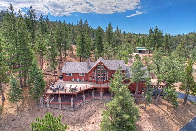 ***HUGE PRICE REDUCTION*** Custom built mountain house in Rimwood Ranch with developed horse facilities. Fully fenced and gated on 4.77 acres. Very private and quiet. The home was completely remodeled in 2019 and features granite countertops, built in appliances, an open concept floor plan, two master suites, private workout room with powder room and sauna, open loft/game room. The recent additions throughout the tree lined property include a beautiful 2-year-old 5 stall North Coast Barn with separate tack and feed rooms, round pen for working your horses and an RV garage with full hookups! The property also features 3 huge private decks, great for entertaining or taking in the expansive views. House comes with a backup generator that can power the home as well as tons of storage under the main house which is accessible via the extra-large 2 car garage. The privacy and tranquility this home and land offers is truly special!