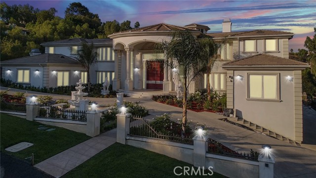 Exquisite custom-built elegant mansion with 14,860 sq ft sits on 47,714 sq ft useable lot, including 11 Bedrooms, 14 Baths. Set atop a hill in the private and exclusive 24 hour guard gated community of The Country in Diamond Bar. The estate offers unparalleled luxury and quality with spectacular views. This home was meticulously designed and finely crafted with every upgrade imaginable. The impressive double doors open up and you are greeted by a dramatic spiral double staircase and souring high ceilings. That allow you to see straight to the beautiful backyard. The gourmet kitchen includes all top of the line appliances and a large island. This home has 3 kitchens which is great for entertaining- the main kitchen, a butlers kitchen and an indoor/outdoor kitchen that leads to the luxurious resort style pool, spa and private basketball court. The main floor has 3 large bedrooms all suites, a private office, a piano room, a library room, a formal living room, a family room and yes a Theater Room. Lets go up the beautiful spiral staircase, you walk into the huge Master suite with outdoor patio, a lavish master bathroom with therapeutic soaking tub, oversized shower with steam, dual sinks, dual toilets and dual walk-in closets. That's not all, on this floor you also have an entertainment room and 5 large bedrooms suites all with walk-in closets and spa bathrooms. Lets take the elevator down to the basement. This floor provides 2 large bedroom suites both with walk in closets and spa bathrooms. If you have guest stays, this floor is perfect as it has its own private access from the driveway, so guests can walk in without having to go through the front door. You also have access to the laundry room, the gym, the sauna, a wine cellar and 2 large storage rooms and an 8 car garage. **If you are looking for a large home- that is perfect for a large family with in-laws or extended guest stays for the holidays. You have found the perfect home that offers the needed space and privacy.