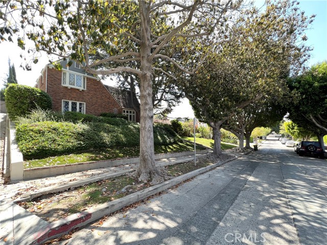 Diamond in the rough you've been waiting for, first time on the market in over 50 years! This traditional English, two story home is an architectural gem, nestled in the foothills of Griffith Park on a tree-lined street in the prime area of Los Feliz. Built in 1923, this home is waiting for the right owner to come and bring it back to its true self. Features of this English gem are as follows; the front of the home features red brick, leaded diamond windows & enclosed covered entryway. Upon entry is the original arched top solid wood entry door, high coved ceilings, a formal living room with a stately fireplace. There are multiple arched doorways giving visitors a visual treat upon entry. This home is an entertainers delight complete with a formal dining room which boasts lots windows plus a sweeping view of the backyard. Off the dining room are double French doors leading out to the covered backyard patio, perfect for indoor/outdoor entertaining. Downstairs, there is also a cozy den which was a bedroom at one time (the closet was converted to a bar), down the hall is a spacious full bathroom.  The kitchen, which is accessible by the hallway or the dining room, has high ceilings, hardwood floors, a separate adjacent kitchen nook, perfect for informal dining.  Off the kitchen is a pantry/ laundry room with access to the side yard & lots of room for extra storage. The hallway downstairs has access to the California basement.  The stairway in the living room leads up to the (3) bedrooms, one overlooks the front yard and has a elegant seating area under the leaded glass diamond windows, the 2nd bedroom is equally spacious and has a convenient walk-in closet + vanity area, the 3rd bedroom is smaller and would be a perfect office if need be. The upstairs bathroom off the hallway is the only bathroom upstairs, it is a full bath. The backyard is reminiscent of an old English garden, complete with roses and hidden architectural delights like the wood-like shingles on the back side of the home & the brick walkway. There is a long driveway with a gate that leads to the two car garage. Located on a tree-lined residential street & close to the village & the Greek Theatre. Perfect for those who want to be close to city life and nature.  Won't last long, don't hesitate to see this property ASAP! Trust sale, no court confirmation required.