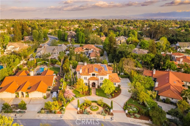 A true gem! This Luxury and elegant custom built COMPLETELY UPGRADED estate is situated in the prime area of North Claremont. Huge & ALL FLAT park-like backyard (23,356 SF) LOT with 5BR and 5.5 BA (total 5 SUITES) with exquisite endless details throughout. Very open & impressive floor plan w/ high ceiling. Hardwood and stone flooring, Recessed lighting, crown moldings and 3 fireplaces. Large living room and family room with fireplaces. Impressive gourmet kitchen with large center island & top of the line appliances including built in microwave and double dishwasher. One large parents suite located on main floor. Master suite has large walk-in closets, Jacuzzi and heated floor in the bathroom. 3 car garage attached. Huge private and secluded backyard professionally landscaped. Large gazebo with full outdoor kitchen include wok burner, dishwasher, refrigerator, BBQ & fire pit. It is entertainers delight! Walking distance to wilderness walking trails and only minutes drive to The Webb private school. Close to shopping center, Claremont Village and Claremont 5 Prestigious Colleges. 7.5 kw Enphase microinverter solar panels and Electric car charger in garage both have been FULLY PAID OFF.