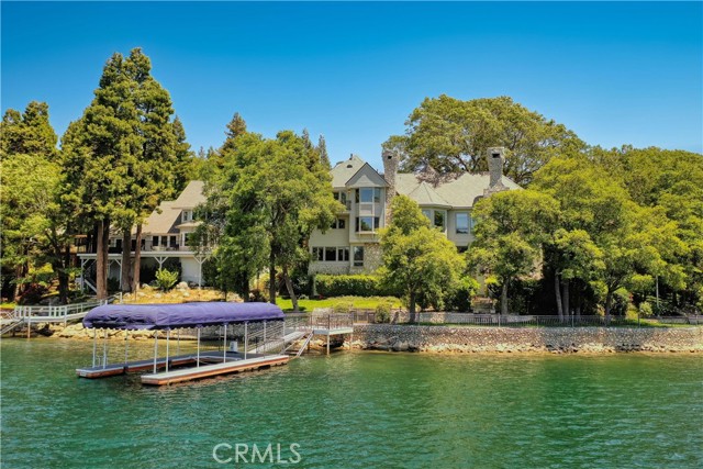 * Lake Arrowhead Lakefront Home in Sought After Point Hamiltair. Well located on the south side of the renowned gated peninsula offering impressive wide-open lake views from the south-west around to the south-east. Upon arrival through the property s iron gate, the level circular driveway and porte-cochere offer all-season easy entry. The entrance is grand with first impressions captured by the circular staircase, wide-angled lakeview and the large-scale great room, fireplace, formal dining, wet bar, viewing deck and tall ceilings. Also, on the main level we ll find the spacious kitchen and guest suite. The upstairs master bedroom suite is private and large consisting of 4 rooms. Spacious bedroom with lakeview, fireplace & wet bar - Her full bath with closet, spa tub, shower & sauna - Adjacent is his bath & closet with entry to next-door shower and sauna. And next to his bath is their private full-sized den. In addition, you'll find a very unique & rare feature - an Observatory. Downstairs at ground level are 2 more guest suites, lake views, family room, office space, reading room & lake access. Lake Side offers a level grass area bordering the stone seawall with iron fence, outside dining, built-in barbeque and sink with level access to pier and private single slip deep water boat dock with canopy frame. An Impressive Package with prodigious Price Drop !