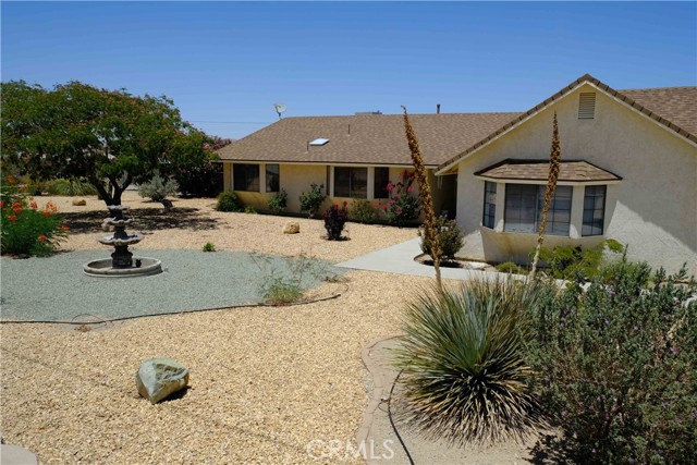 Don't miss this beautiful 4 bedrooms and 3 baths home in one of Barstow's most desirable neighbors.This beautiful home has loads of recent upgrades. A totally remodeled kitchen with Quartz countertops, recessed lighting, large island with seating, and upgraded appliances and opens into a large family room, there is also a walk-in pantry with a barn door. This large open family room has laminate floors, cathedral ceiling, with ceiling fans and a beautiful hearth with a standing wood burning stove. The large primary suite has ceiling fan an a completely remodeled spa like bathroom. Additional bedrooms are all good size. Each room is equipped with ductless AC. This home sits on 1.36 AC with plenty of room for RV parking and storing of all your toys. Electrical panel was upgraded to 200 amp service.