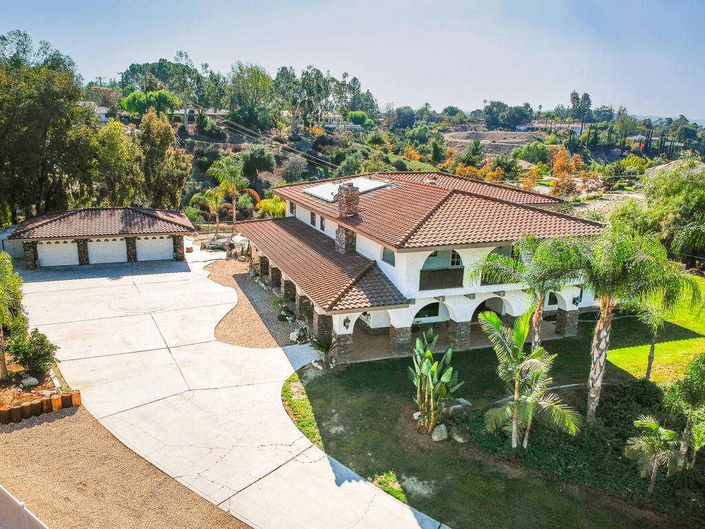 This beautiful custom-built two-story home is located near the sought-after Redlands Country Club golf course area. It has a huge workshop and can legally accommodate 3 horses! This home is 5,605 square feet, has five bedrooms, 4.5 bathrooms, and sits on 1.62 acres of gorgeous panoramic views. This is one of the largest lots in the neighborhood!!! Many upgrades throughout the home. Stay warm with 3 stone fireplaces or take a dip in the pool in the summer! Enjoy fun and games in your own billiards room and wet bar area. Enjoy other amenities such as a large laundry room, built in desk, granite countertops, and marble bathroom floors (except master). Exterior upgrades include mature fruit trees, a lagoon style saltwater swimming pool, koi pond, cave, waterfall, BBQ island, fire pit, patio cover, workshop, parking for trailers, boats, and RV s. The city allows 3 horses on this property, and it includes a wash rack! Make an appointment to see it today!