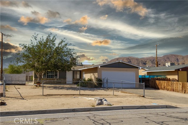 Back on the market due to no fault of the sellers or the house. We had 3 different buyers that couldn't qualify for their loan. We have a current full price appraisal. Only 10 minutes from Barstow.  Awesome 4-bedroom house close to Interstate 15, Eddie World and the world-famous Peggy Sue's Diner. Quiet little neighborhood just outside of the city of Barstow. Great commuter friendly area. Be greeted by a Super cute little flower and foliage garden with auto-drip as you enter the fenced and gated front yard.  Fresh paint inside and out. Spacious floor plan with four full bedrooms and 1 full plus 3/4 bathrooms. Large eat-in kitchen with lots of cupboard space, access to rear yard and ceiling fan too. Copper plumbing and upgraded electrical! Tiled floors in the kitchen and baths, laminate in the living area and carpeted bedroom. Spacious yard with large concrete slab perfect for entertaining; large shade trees and prolific peach and apple trees!! Easy access to some of California's best desert trails, hiking, and very well-known Calico Ghost Town is only minutes away.