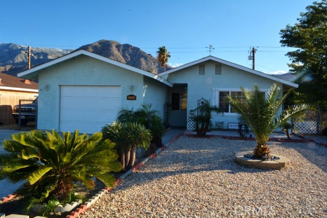 Great location for this turnkey home.  Attractive location near Palm Springs, Morongo Casino, Cabazon Outlet Mall and just a short distance from Interstate 10 Freeway. This move in ready home has 3 bedroom, 2 full baths, Central heat and Air, added a/c window units to accommodate those warmer days.  Private covered entry welcomes you to the spacious, living room, breakfast nook and kitchen.  The flooring is tile in kitchen and bathrooms with carpet in living area and bedrooms.  1 bedroom has mirrored closet doors, spacious owner's suite.  Newer a/c unit.  This home is too nice to pass up. There is a spacious 1 car garage with laundry area.  Paved driveway accommodates at least 6 cars and there is RV parking approximately 16' x 30'.  Leased solar system to offset utility costs.  The spacious backyard allows ample room for children/gardens/toys, etc.  Call today to schedule your appointment.