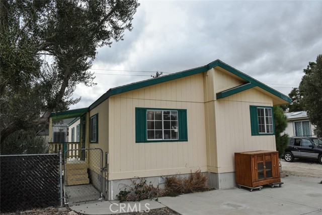 Wonderful, AFFORDABLE opportunity near the Community Center in Cabazon!! Close to the casino, outlet mall, and freeway access and with stunning mountain views, this 2 bedroom with an office (potential 3rd bedroom, you'd just want to add a wardrobe), 2 bathroom manufactured home (RECORDED 433!!) features an open floorpan with the dining/kitchen area open to the family room, an indoor laundry room, and a master bedroom with en suite. The kitchen features plenty of cabinet storage, as well as an island and ample counter space which extends into the dining area (there is even a desk space).  Fully fenced with a car and a man gate, the home is situated to the side, allowing room for vehicle and potential RV parking, with room left over for a garden, yard space, etc. Need storage? There is a spacious shed, as well as room to add another or perhaps to build a garage if you're feeling so inclined.  While there are a few repairs left to make this home absolutely shine (and to make it feel like your own), there is new carpet in the bedrooms, family room, hallway, and dining area!!  Don't miss your opportunity to make this home your own or to snap it up as a rental property!