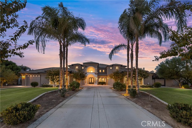 Unique custom built Mediterranean home in one of Bakersfield's most prestigious neighborhoods, Talladega. Upon entering this grand home with vaulted ceilings, you will be amazed by the detailed finishes and extensive upscale amenities throughout. Amenities include a double island quartz kitchen with designer cabinets, custom backsplash, top notch appliances, vegetable sink, and oversized walk in pantry. This home has a separate entrance from its personal garage or from backyard to an inlaw suite/guest house with bathroom and living room downstairs. Three bedrooms, including the main suite with balcony, are upstairs and three downstairs with one being used as an office and another one being used as a game room. The park-like grounds are amazing overlooking a pool with deck jets, firepit, walk in entry, and upgraded lighting. This home is located on a cul de sac and has 7 car garage with wrought iron gate RV parking. Solar is owned!