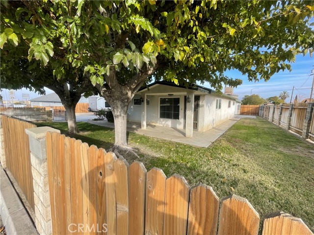 Two lots in one sale..!! One lot has a 3 bedroom and 2 bath nicely tucked away in great neighbor close to Taft College.. An extra Den in the back that can easily be used as a 4th bedroom.. A separate dinning room and much more. The other lot is empty and ready for an additional build or a 2nd home to be used as a rental, Live in the main house and rent the other!! does have a back ally entrance and separate 2 car garage with tool bench. Call your favorite realtor to schedule a showing now!!