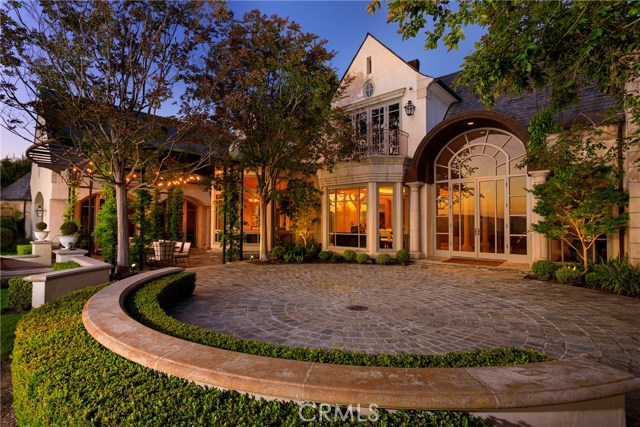 Experience pure opulence in design and function in this Bear Brand Ranch tour-de-force of French-inspired architectural brilliance. Every inch of this aprox 8,900 sq. ft. estate has been carefully curated with structure, entertainment, and harmony in mind, featuring artisanal wood and marble flooring, columned dining room and living room, soaring coved ceilings, arched entryways, and landscape picture windows leading the eye to expansive ocean and island views. Awaken each sun-filled morning and gaze upon the Pacific in the oversized master bedroom with spa-inspired bathroom. With 6 spacious bedrooms, this distinctly refined residence is ideally suited for optimal luxury, privacy, and comfort. With a modern and generous chef s kitchen, wine cellar with tasting area, aprox 1,100 sq. ft. guest cottage, as well as several loggias with stone fireplaces and sprawling French gardens, this abundant 2 acre estate is tailor-made not only for hosting stylish celebrations and delighting esteemed guests, but also for peaceful, present living in a serene, pastoral, and sunset-drenched environment. Including a 4 car garage with long private driveway, this picture-perfect gem is ideal for the automobile aficionado, and offers plenty of storage for the outdoor and sporting enthusiast. Located in one of the most exclusive communities on the California coast and surrounded by fine dining and breathtaking nature, this stunning property redefines the sensation of luxury living.