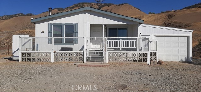 PANORAMIC VIEWS!  Stunning views on top of the mountain!  Sitting on just over 5 acres of land this home affords great privacy.  Well located for the outdoor enthusiast.  Frazier Park adjacent and 17 minutes from Pyramid Lake for boating and fishing.   Manufactured home built in 2004!  Turn key and ready to move in!   Freshly painted interior.  New Vinyl Plank Flooring in Kitchen and Dining area.  New plush carpeting throughout the rest of the home.   Open concept with large living room, spacious kitchen with island, and plenty of natural light!   Great size guest room and bath, large master suite with oversized master bath.  Slider with deck of master for easy access to back of property and 20'X25' metal garage with power. Workshop attached to home gives plenty of space for any mechanic or enthusiast!  Equestrian zoned!  Very private at the end of the road!  All fenced in property and connected to local Lebec water!  Just 30 min away from Santa Clarita!! Seller will carry financing.