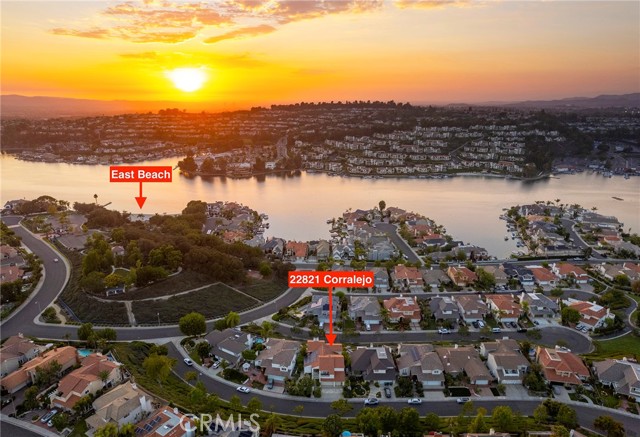 Amazing Sunset and Lake Views! Beautifully updated 5-bedroom 3 full bathroom property located in the exclusive East Beach community on Mission Viejo Lake. Nestled on a single loaded Cul-De-Sac. Enjoy walking into your private courtyard. Sounds of a beautiful fountain will greet you. As you enter through the main front door you will be amazed with views of the lake and surrounding mountains. As you continue in you will find a kitchen made for chiefs. All Viking appliances! Cook and entertain while you and your guests enjoy the awesome views from inside and out. The backyard has a built-in BBQ, Travertine patio, fireplace and 3 automatic awnings.  The master bedroom, of course, has elevated views. Boasting 2 closets and a stunning, upgraded bathroom fit for a king! Fully paid solar! You will love parking in your 3-car garage with epoxy flooring and walking to your own private beach.