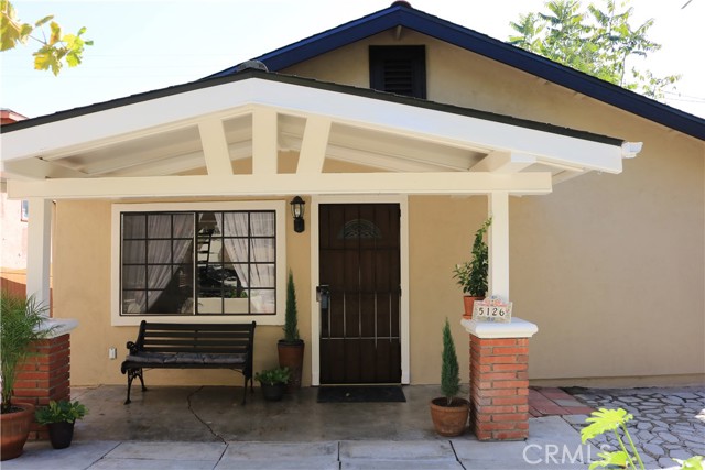 This home features some original craftsman style charm like a built-in China cabinet, some original doors with glass door knobs, a functional floor plan, and a front porch that displays its architectural design. This 1918 Craftsman Bungalow home includes a completely remodeled Jack & Jill bathroom, La Belle Purity tiled shower, new faucets & vintage-style pedestal sink, all while staying true to the original charm of the home.  Large windows throughout, allowing for natural lighting in living, dining, kitchen, laundry, and bedrooms. Bamboo flooring, open living & dining area, and beautiful woodwork including framed windows, built-ins, and beamed ceilings.  The newly remodeled kitchen offers new: cabinets, pantry, quartz countertops, single basin stainless steel sink, 5-burner range, range hood, flooring in kitchen/laundry/& bathroom. But, it doesn t stop there - additional features include new: roof, water heater, privacy fencing, and all new paint throughout the interior & exterior of the home!  If that s not enough, it also offers a huge yard and mature fruit trees, such as avocado, grapes, pomegranate, lime, loquat, & fig!