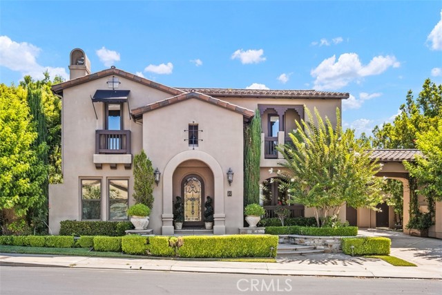 Ideally positioned on a 10,668 SF corner Lot in South Coto, this expansive San Marino Plan 2 estate boasts sophisticated elegance in a warm and welcoming home. With over 5800 SF of living space, this property has every desired amenity. Upon entry, the grand foyer showcases a gorgeous  La Scala  circular staircase and custom wood floors. The beauty and elegance emanates throughout with warm wood accents complementing architectural features like high ceilings and built-ins. This property offers 5 bedrooms, including a highly desirable main floor suite, ideal for guests or extended family. Upstairs discover a stunning primary bedroom with a private balcony and a pass-through fireplace for the bedroom and sitting room. A gorgeous and expansive en-suite bath creates the perfect oasis with its large soaker tub, double walk-in shower, and separate vanities. Three additional bedrooms and a deck space complete the second level. Downstairs enjoy a private library/office- a great space for today s  work-from-home  flex schedules. Enjoy both formal living and dining rooms, the upgraded chef s kitchen with Viking appliances, endless cabinet storage, an eat-at island with seating for 4, breakfast nook, and an oversized butler s/cater kitchen, ideal for entertaining. The backyard personal resort boasts a saltwater pool/spa, built-in BBQ, seating areas, and immaculate landscape,  all surrounded with lush tropical blooming flowers and trees creating a private and inviting outdoor retreat. Complete PEX repipe in 2020 that includes manufacturers lifetime warranty.