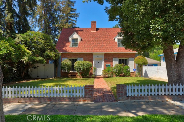 Charming colonial revival in South Pasadena with a guest house on a large flat lot.  Great floor plan with one bedroom and a bath downstairs, and two bedrooms and a bath upstairs.  The living room is large with a very charming bay window, a handsome fireplace and attached sunroom, which is a perfect place for morning coffee, an office, or a guest bedroom.  The formal dining is adorned with attractive corner built ins, sophisticated striped wallpaper and a bank of windows with a stunning design.  Both the upstairs bedrooms are large enough for bedroom furniture plus a desk.  The quaint detached guest house is perfect for guests or perhaps a rental for extra income, it offers a bathroom and fireplace. The back yard is large and flat with a huge lawn area, deck, and mature landscaping including gorgeous trees which create an enchanting ambiance.   The property also features a laundry room, copper plumbing, central A/C and heat, a newer roof, newer double pane windows, plantation shutters, a detached 2-car garage, and of course the desirable South Pasadena schools.  All of this and only half a mile from the shops and restaurants on Mission and Fair Oaks.