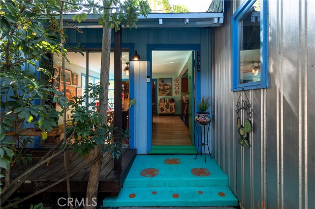 This charming 1949 tri-level canyon cabin is a private getaway right in the middle of the city.  Hidden from the street by tall hedges, 3804 Glenalbyn Drive embodies the appeal of an artist s hideaway with a unique multi-level flow that enables solitude within, while embracing the natural setting just outside. Nature s tones are the order of the day from the burnt orange and blue hues of the kitchen to the sky blue exterior ribbed aluminum siding.  The custom touches throughout compliment a warm and intimate feel in this 2bd/2ba street-to-street tucked-away gem.  Each level has its own distinctive personality. Upstairs is devoted entirely to a single bedroom, primary bath, and a balcony.  The main level welcomes visitors to a bright great room/open kitchen.  Down a short staircase one finds the living room with a hearth-style fireplace and quaint library suitable for a study or studio.  Continue through French doors which lead to a secluded and spacious backyard featuring shade trees, a large patio, and a fenced dog run.  Kitchen appliances include a 6-burner Bertazzoni double oven, an additional Heartland oven, a Viking professional refrigerator, two dishwashers and a Samsung washer/dryer.  The stairs leading to the finished basement boast an original space-scape painting by artist Jamey Bair. This home is truly one of a kind. Please note there is a discrepancy on the bed/bath count, buyer to verify.