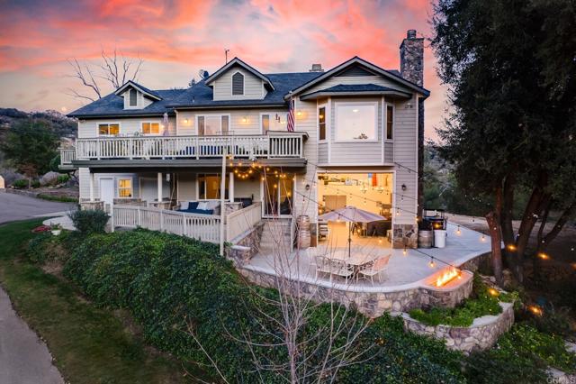Welcome to Seven Meadows Vineyard, a stunning gated 2-on-1 estate nestled on 11.43 acres on the highly sought after west end of Ramona. Generating more than $14,000/month and $168,000/year in tenant rental income (6% cap rate), this tranquil property features a primary home with 4b/3.5b and attached wine making facility/tasting room/cellar, guest house with 5b/3b, 3 vineyards with more than 500 vines and 5 varietals, 125 fruit trees and so much more. The primary residence boasts open concept living met with soaring, wood-beamed vaulted ceilings, high-end finishes, spacious entertainer's kitchen, sprawling family room with cozy fireplace, and private balcony w/ pizza oven, built-in BBQ, spa and fire pit. Downstairs has a separate entrance to 1b/1b and fully equipped kitchen for bonus rental income. Across the vineyards you'll find the secluded ADU, featuring an upper level 3b/2b and lower level 2b/1b w/ separate entrances. Each with private balcony & shared laundry. Endless additional income opportunities (winery, tasting room, potential event space)! Usable acreage offers opportunity for equestrian use. Grape Varietals: Zinfandel, Syrah, Tempranillo, Grenache, Mourvèdre. Tenant occupied; no showings without accepted offer.