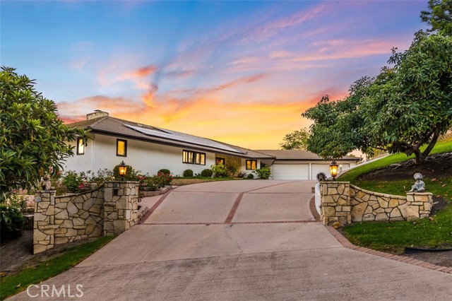 This classic Ranch home sits inside the most desired gated city in Palos Verdes, Rolling Hills. The home has been with the same family since it was constructed in 1981 and offers unobstructed, panoramic city, pastoral and Queen s Necklace views. With 6,732 sq ft of living space the home has every amenity you could ask for including a large master suite with open ceilings, views, walk in closet and large master bath. Other features include 5 additional bedrooms, 5 additional bathrooms, sauna, a game room, and a bonus room that can be a workshop, gym or anything you desire. The living room has open ceilings, a fireplace and plenty of space to entertain as it flows to the backyard. The oversize kitchen opens to the family room making for a spectacular great room that has open Redwood beamed ceilings, bar and fireplace. As you step onto the back deck you instantly take in the panoramic views that the patio and pool area enjoy. There is a pool and spa as well as a lower pad that can be used for a barn, ADU, guest house etc. Throughout the property you will find fruit trees, a rose garden, a vegetable garden and space to add other amenities. For the car enthusiasts, let's not forget the 8 car garage with extra tall doors and ceiling for potential car lifts etc. The home runs completely on solar and the owner is not paying anything for electricity. On top of that, the pool has solar and the seller states during the summer it stays between 80-90 degrees. The last bonus is there is an unfinished basement area where an owner could built out a wine cellar. This property was built with an amazing floorplan and and the future in mind given the high ceilings, wide hallways and large rooms.