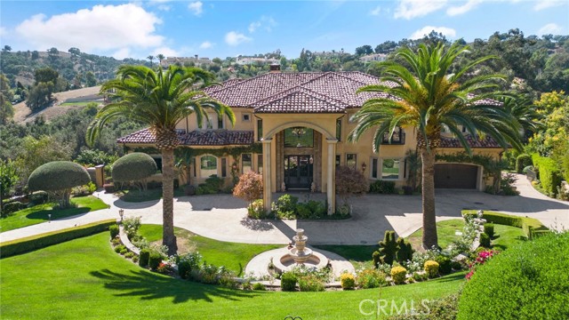 Spectacular Mediterranean Estate in the exclusive Gated Community of Oak Tree Downs, adjacent to Western Hills Golf Course & County Club. Over 10,000 sq. ft. of Luxury Living Space. Nothing was compromised from it's Top Quality construction to the smallest detail-Grand Foyer with Beautiful Domed Entry-Dual Forged Stairwell-Elegant Chandelier, electronically controlled, 5 Spacious Suites each with own powder room and balcony-Two Master Suites, Upstairs Master offers private retreat with own Romantic Fireplace, Bookshelves, Wet Bar Refrigerator, elegant Bathroom w/Granite Counters, dual sinks, vanity, dual shower heads, Spa Tub, His & Hers Walk In Closets & Private balcony, Great Room-9 Ft doors thru out, Euro designed Fireplace, Bonus Room with large Wet Bar-wired for flat screen TV's thru out, Touch Controlled Lighting, Laundry Shoot, Elevator, Surround Sound, Surveillance Security System with 5 Alarm Pads, Gourmet Kitchen-Wolf Range w/2 Ovens, Food Warmer, Steamer-Sub-Zero Refrigerator-Basement Offers Tea Room, Gym, Bonus retreat area-Gorgeous back yard with beautiful gardens with walking pathways, Patio and for Summer Entertainment Plus Resort Style Infinity Salt Water Pool & Spa. A MUST SEE, TOO MANY FEATURES TO MENTION.