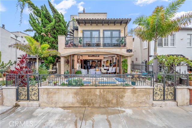 A rare opportunity to own this Spectacular Mediterranean-inspired waterfront Naples Home. This home has lots of open light-filled spaces along with 3 bedrooms, 3 1/2 baths, and a private 28' boat dock. At waterfront entry, you are greeted by a custom fire pit along with built in seating. The front entry has 9 ft high glass bi-fold doors that completely open up to create a coveted indoor/outdoor living space.   The stunning travertine tile begins outside and extends throughout the entire first floor. The living room area, of the open concept great room, has soaring 16 ft ceilings!   Here you will find a built-in wet bar, custom cabinets throughout, a gas fireplace, a massive ceiling fan, Lutron motorized shades, and an included TV entertainment system with integrated  control 4  and  Sonos  systems. The kitchen area has granite counters, along with 2 islands, a double sink and a prep sink, spacious pantry, top of the line Viking Appliances, a wine refrigerator and a dumb waiter for roof top entertaining. Completing the first floor, you will find a powder room and the attached two car garage with custom storage cabinets.  The second floor includes two bedrooms ( one with en suite and one with a walk in closet), a library area, a large additional full bath, an extra large laundry room and access to the 2nd floor patio.  The third floor includes the spacious en suite master bedroom, sun room, a walk-in closet and access to the rooftop deck. All three bedrooms include built in AC. The expansive rooftop deck, is PERFECT for entertaining and is VERY private! It includes an outdoor kitchen with a sink, bbq and beverage fridge. To top it off, enjoy the jacuzzi, the fireplace and the magnificent views of the canal and neighborhood.