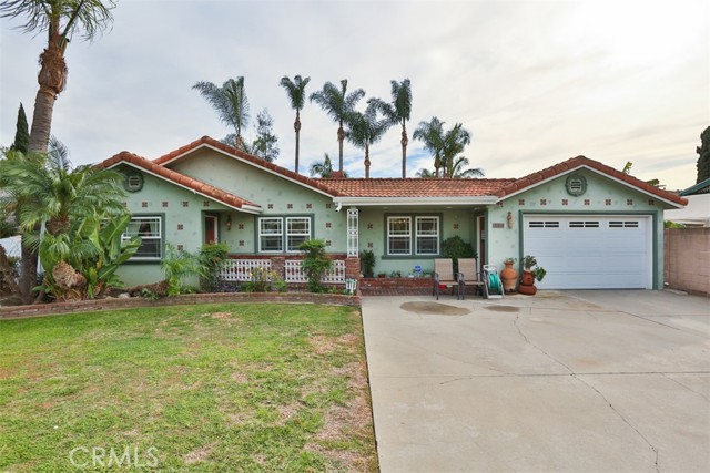 Gorgeous, pristinely maintained large home in the heart of a lovely Bellflower neighborhood on a wide, tree lined street. First time on market in 54 years, per seller.  Stroll to the quaint Historical downtown with shopping, restaurants, banking, City Hall, parks and more nearby. Easy access to the 91 & 605 fwys with Cerritos Mall minutes away. Charming curb appeal: this home sits on an almost 10,000 sq. ft. lot with sprinkler system, pool, above ground, bricked in  8-10 person spa, private atrium style patio accessed through office and from backyard and has extended concrete walkways on side with sump pumps for drainage. Back yard is a landscaped entertainer s delight surrounded by king and queen palm trees and a lime tree.  Pool & spa have separate heaters, filters and pumps. Driveway in front of garage can accommodate at least 6 cars. Extra long separate area behind wide gate on E side could accommodate additional cars, RV and/or boat. Extra storage with shed in back and huge attic accessible through main bedroom closet. This home boasts 5 bedrooms (5th bedroom currently used as a home office). Main bedroom with beamed ceiling has fireplace, wet bar, and extra large walk-in closet (300 sq ft as measured by seller) and direct access to backyard entertainment pool area. Main bathroom has beautiful jetted tub. French Cafe style kitchen has black granite counter tops, marble floor and custom ash cabinets. 3/4 bath and pantry off of kitchen. Large elegant dining room for your dining and entertaining pleasure. Fabulous black & white marble hall bathroom has custom cabinets. Spacious family room has beamed ceiling, 3 skylights, fireplace and direct access to backyard. Laundry room with custom cabinets & Solatube. All windows are 9 light double payne. AC system has 3 zone control with 3 separate thermostats. Newer roof (2007), motion sensor lighting on both sides of house plus atrium, alarm and surveillance systems. Tankless hot water system.