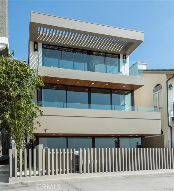 Built & designed by Silicon Bay Development and Laney LA architects, this beach front home for the most discerning, design oriented buyers is available once more. This 3,750 square foot warm modern residence rests on a quiet part of the Hermosa Beach Strand, centrally located between piers. Finishes include Fleetwood doors and windows Architectual Board Form Concrete French White Oak Wood Flooring Rift White Oak Cabinetry with high gloss kitchen uppers Clear Cedar Tongue and Groove ceilings Kitchen Counter Walker and Zanger leathered Nuage Quartzite, Great room Bar Walker Zanger Calcutta polished marble, Master Bathroom Ann Sacks Eros Grey honed Master shower and integrated sinks, Rec room Bar Leatherized Polar White Quartzite, Guest Bath Walker Zanger honed Basaltina Robern Backlit Master Mirrors and Vanities, Paris Backlit Powder Mirror Stainless Steel Plumbing Fixtures by Hansgrohe and Axos, Victoria + Albert Barcelona Master Tub Kitchen Appliances - Miele 48" Range 2 Miele 30  inch ovens Miele Microwave 2 Miele Dishwashers Subzero Full Height 30 inch Wine column Fridge 1st Floor Rec room Bar - ULine Beverage Center / Ice machine, Miele Dishwasher Full height Fleetwood Sliders and Windows are interior doors 1 1/4" Rift White Oak Interior jambs and doors. Technology Crestron Lighting System and recessed pocket shade.