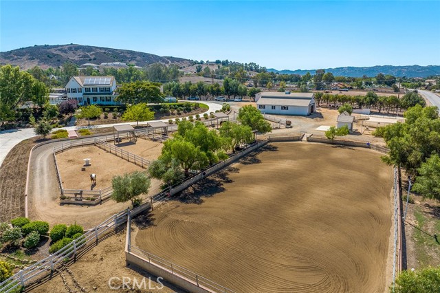 ATTENTION HORSE LOVERS!  This ranch estate in the heart of La Cresta on SoCal s Santa Rosa Plateau has it all!  It is 100% usable with multiple gated entrances, 2-bedroom guesthouse with garage, separate apartment, pool, breezeway barn, separate workshop barn, several storage outbuildings, lighted arena with viewing deck, round pen, and cross-fencing.  The charming, stylishly updated farmhouse has three spacious ensuite bedrooms, an elegant office, and a massive wrap-around deck and gazebo, where you can unwind and watch the farm animals from your perch above the weeping willow graced grassy lawn. This setting is straight out of a Hallmark movie and will charm you from the moment you enter the main gate. Not only is it a fully developed working ranch, but it is positioned in a very easy location, just a few minutes from the main entrance to the Plateau, and less than 15 minutes from shopping, schools and freeway. This is a rare opportunity to move right in with all of your critters and begin living the La Cresta Life!  *****Discover the Santa Rosa Plateau Lifestyle: 5-acre minimum parcels, friendly neighbors, star-filled skies and peace   all just minutes from the conveniences of town, schools, restaurants, hospitals, grocery stores, the 15 Freeway, and the famous Temecula Wine Country. Enjoy room to take walks, breathe clean air, grow gardens/vineyards/groves/orchards, partake in equestrian activities & community events, raise animals, and hike/ride miles of trails via the robust private recreational trail system & the thousands of acres of the Ecological Reserve.   All less than 1.5 hours from LA, San Diego, OC, Palm Springs & Big Bear. Discover the country, yet convenient, lifestyle of La Cresta!
