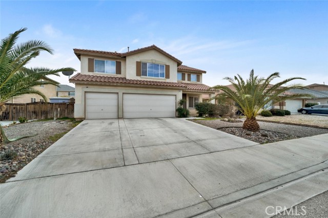 Welcome to this beautiful, spacious 5 bedroom, 3 full bath home located in this highly desired community of Victorville.  This 3,682 square feet home offers an open floor plan, with a large kitchen and family room.  The downstairs also offers a bedroom and full bath.  As you come up the stairs you will be greeted with a huge loft ready for a pool table or game room decor. Double doors open up into the  master bedroom which provides a retreat complete with dual sided fireplace.  You can set up a cozy sitting area, an office or workout area.  Enjoy your favorite drink under the newly installed patio cover or sit poolside.  This home is a must see!!