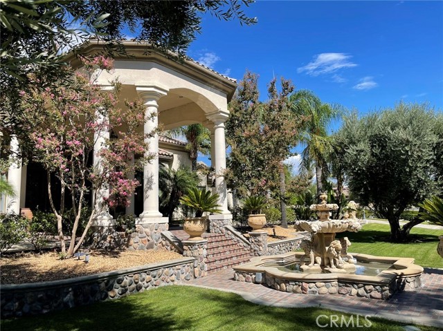 THIS AMAZING MEDITERRANEAN STYLE ESTATE DEFINES PURE ELEGANCE! LUXURY LIVING ON A LARGE ESTATE Situated on over 2.2 acres of manicured grounds. Over 10k of living area includes a 8,400 sq' main living area w/5 bedrooms, 7.5 baths, library, game room, entertainment/gym room, theater, 800 sq' maid quarters, separate 1,100 sq' 2 bed 2 bath guest house. No expense spared craftsmanship throughout. This showcase estate with venetian plaster, travertine floors & custom baseboards + state of the art security & audio system. Chef's kitchen with granite counter tops, island, built-in stainless steel appliances, double oven, 3 subzero refrigerators, Viking 4 burner with grill, trash compactor, warming tray & 2 dishwashers. Spacious family room with fireplace, big screen TV & full wet bar. Formal living room with fireplace. Formal dining room. Master suite with fireplace, retreat and massage room. Master bath features dual sided fireplace, dual sinks, jacuzzi tub, separate large shower & walk-in closet. Impressive backyard boasts Olympic size pool w/waterfalls & spa, covered Travertine patio area, tennis/basketball + volleyball court, outdoor fireplace + pizza oven, BBQ, TV s & heaters, Koi pond, fountains, large golf putting green with 6 tee stations and 6 bunkers, horse arena with stable area & 5 car garage, RV garage. Solar system installed. Fully fenced with a circular driveway.