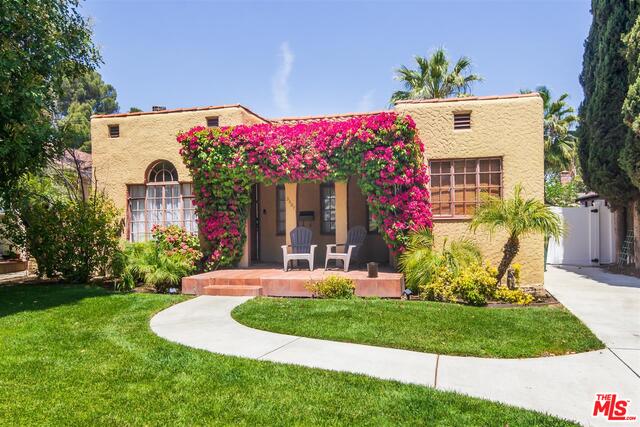 3307 W Wyoming Ave Burbank, California BURBANK POOL HOME! This Spanish style home boasts lots of character and original hardwood flooring throughout. A barrel ceiling, fireplace, & a wet bar round out the living room. A curved ceiling can be found in the dining room as well. The first bedroom/office has built in shelving, great light & privacy at the front of the house. The kitchen has stainless steel appliances and a breakfast bar all open to the great room with Surround Sound. The additional two bedrooms are opposite this gathering space. The main suite has a large, fully updated bath and the 3rd bedroom has built in shelves and is in great proximity to a full bath. French doors in the family room lead you to the custom patio and fenced IN GROUND pool area. Enjoy the two car garage which has been converted to an office/workout room and has an additional storage area. New vinyl fencing adds to the private oasis for the entire property. Showings begin Monday 5/10@4:00pm-6:30pm, Tuesday 5/11@12:00pm-4:00pm, Friday 5/14 @12-4:00pm Saturday 5/15@12:00-4:00pm, Sunday 5/16@12:00pm-4:00pm.